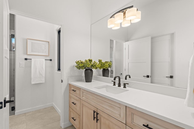 bathroom with tile patterned flooring and vanity