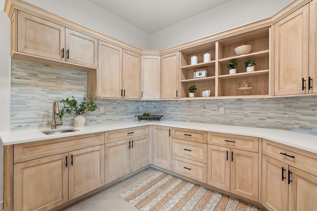 kitchen featuring light tile patterned flooring, light brown cabinetry, backsplash, and sink