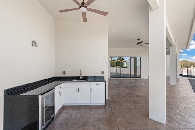 view of patio / terrace featuring exterior kitchen, sink, and wine cooler