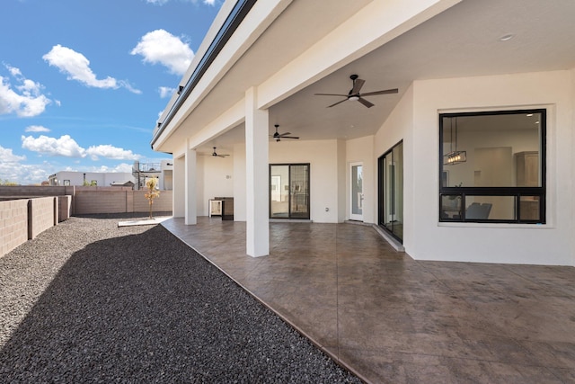 view of patio featuring ceiling fan