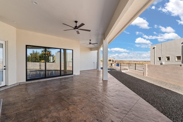 view of patio featuring ceiling fan