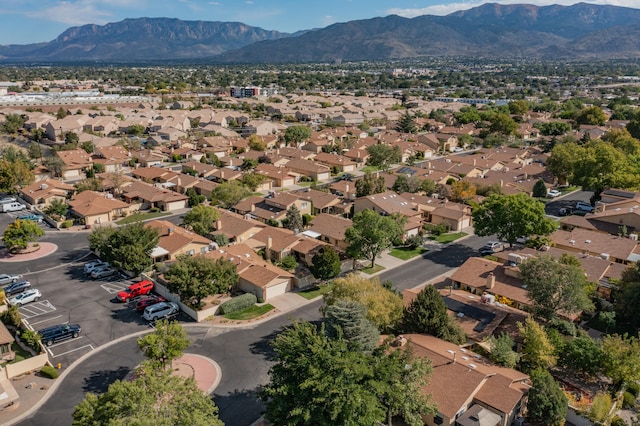 birds eye view of property with a mountain view