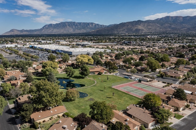 birds eye view of property with a mountain view