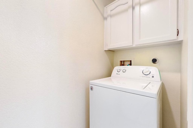 laundry area with cabinets and washer / dryer