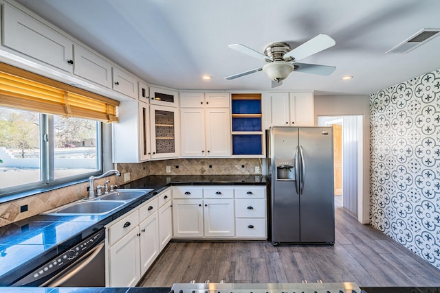 kitchen featuring white cabinetry, stainless steel appliances, sink, and dark hardwood / wood-style floors