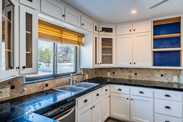 kitchen featuring white cabinetry, tasteful backsplash, sink, and dishwasher