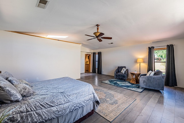 bedroom with lofted ceiling, hardwood / wood-style floors, and ceiling fan