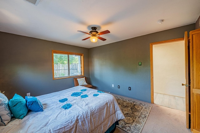 bedroom with ceiling fan and light colored carpet