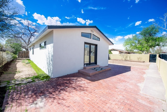 back of house with a patio area