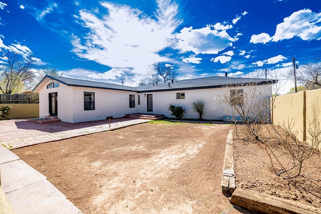 rear view of house with a patio