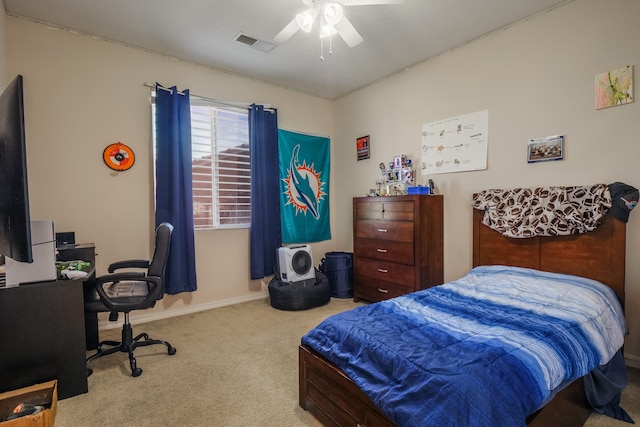 bedroom with light colored carpet and ceiling fan