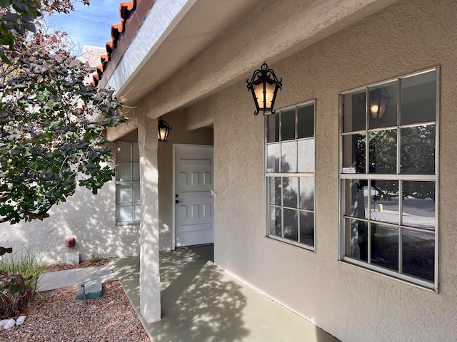 entrance to property with a patio