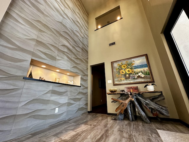 300 Catfish Rd, Elephant Butte, NM 87935 - entrance foyer featuring a towering ceiling, visible vents, and baseboards
