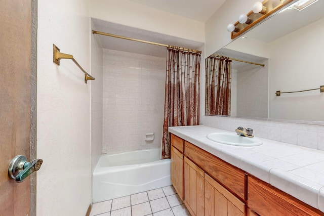 bathroom with shower / tub combo with curtain, vanity, and tile patterned flooring