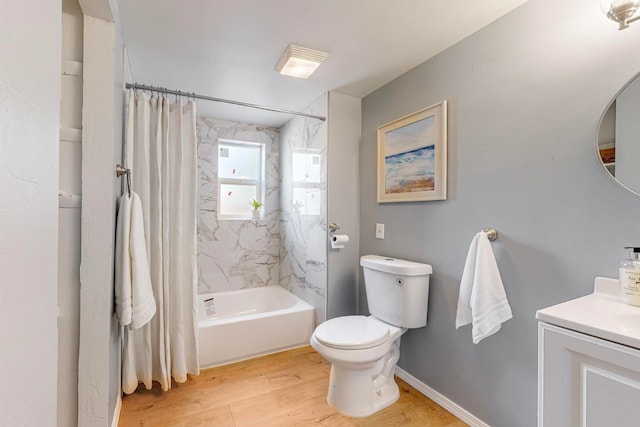 full bathroom featuring vanity, shower / bath combo, hardwood / wood-style flooring, and toilet