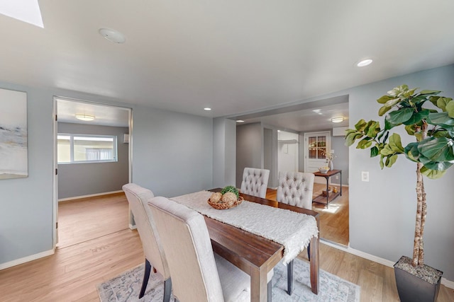 dining space with light wood-type flooring