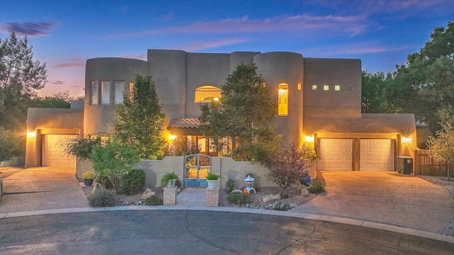 southwest-style home featuring a garage