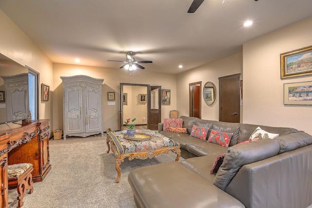 living room featuring light colored carpet and ceiling fan