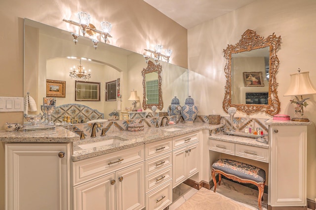 bathroom with tile patterned flooring and vanity