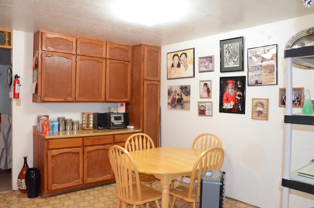 dining room with a textured ceiling