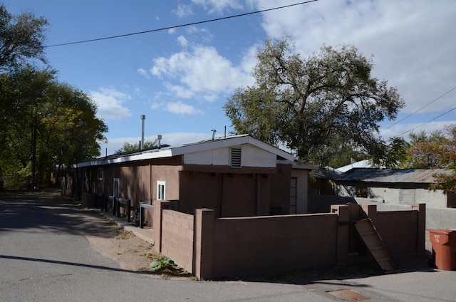 view of home's exterior with a fenced front yard