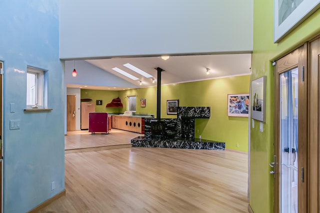 entryway featuring hardwood / wood-style flooring and high vaulted ceiling