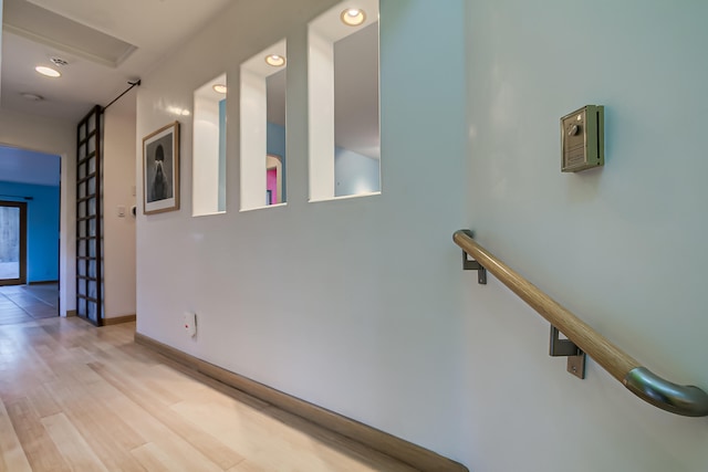 hall featuring french doors and light hardwood / wood-style floors