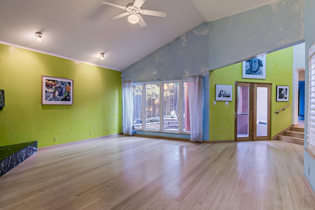 living room featuring french doors, light wood-type flooring, high vaulted ceiling, and ceiling fan