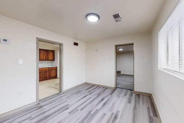 unfurnished room featuring light hardwood / wood-style flooring