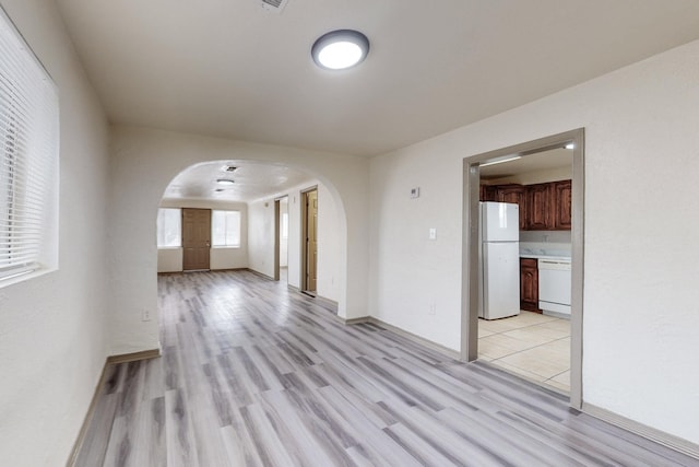 spare room featuring light hardwood / wood-style floors