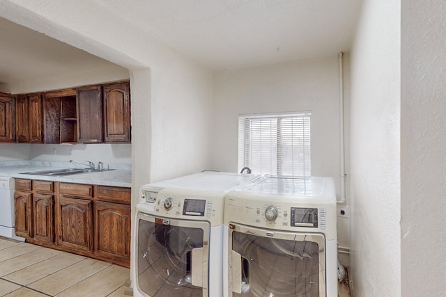 laundry area featuring sink and washer and dryer