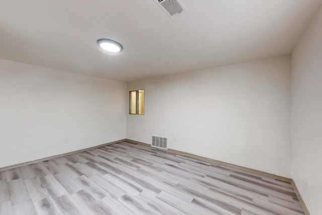 unfurnished room with light hardwood / wood-style floors