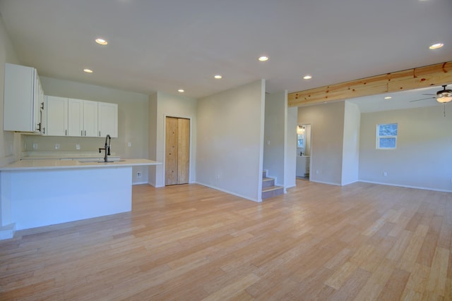 7 Shasta Ct, Cedar Crest, NM 87008 - kitchen featuring a sink, open floor plan, light countertops, light wood finished floors, and recessed lighting
