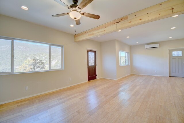 7 Shasta Ct, Cedar Crest, NM 87008 - empty room with an AC wall unit, light wood-type flooring, recessed lighting, a ceiling fan, and baseboards