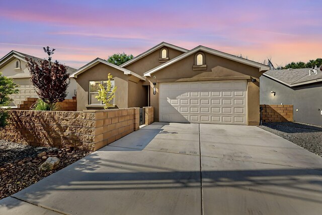 single story home with a garage