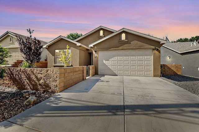 ranch-style home with a garage