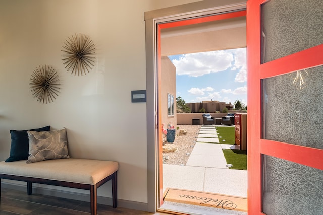 entryway featuring hardwood / wood-style flooring and golf simulator