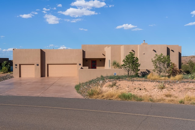 adobe home featuring a garage