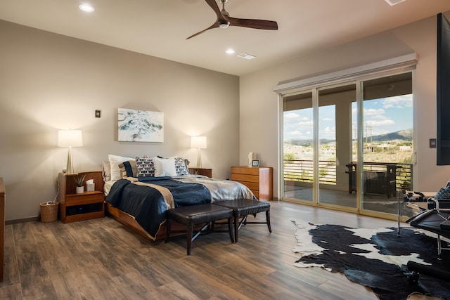 bedroom featuring ceiling fan, access to exterior, and dark hardwood / wood-style flooring