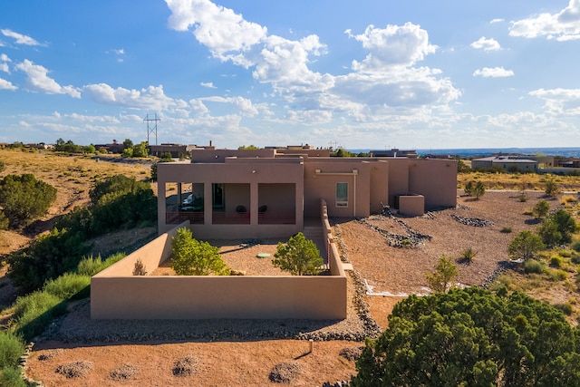 rear view of property featuring a patio