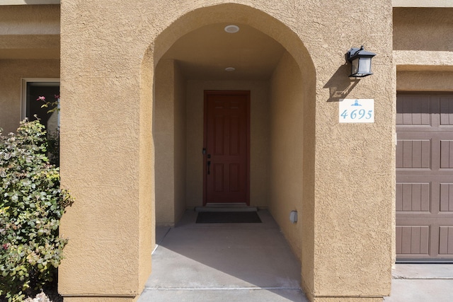 property entrance with a garage