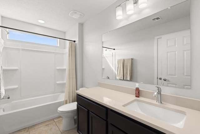 full bathroom with a textured ceiling, shower / bathtub combination with curtain, toilet, vanity, and tile patterned flooring