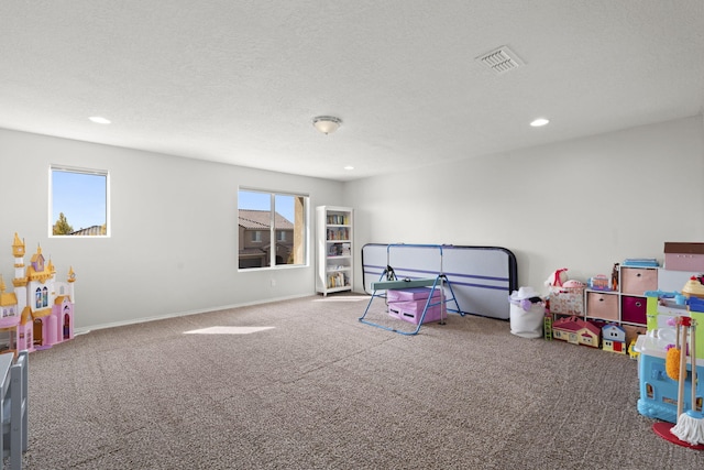 rec room featuring a wealth of natural light and carpet floors