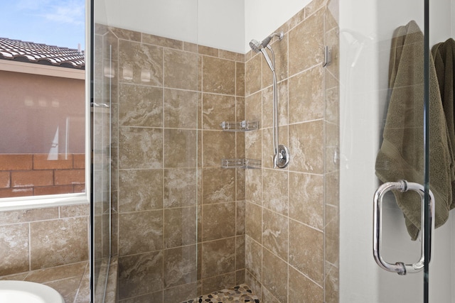 bathroom with a shower with shower door