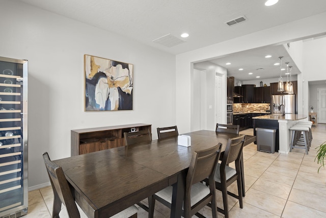 tiled dining room with wine cooler