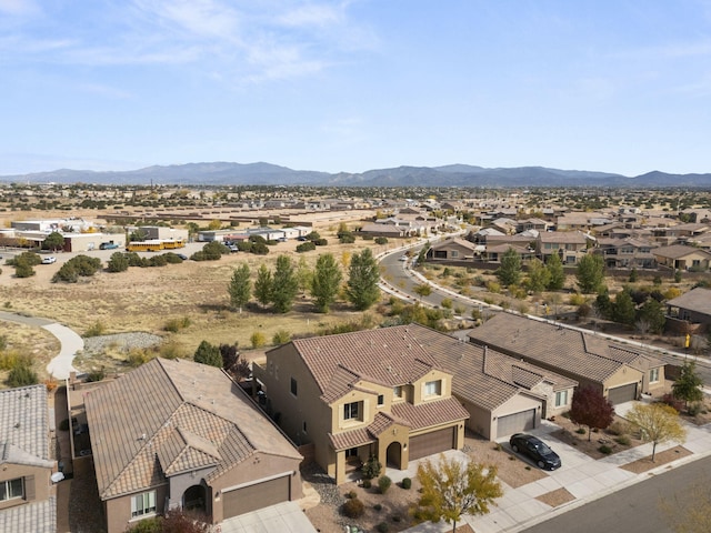 birds eye view of property with a mountain view