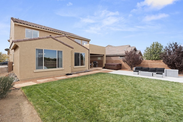 rear view of house featuring a patio area and a yard