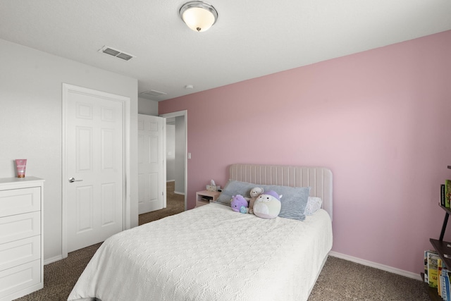 bedroom with dark carpet