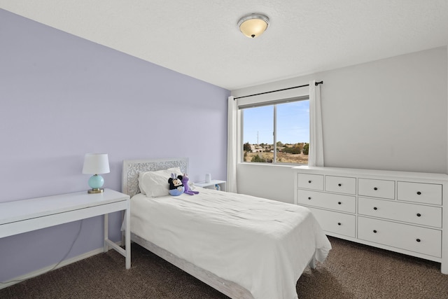 bedroom featuring dark colored carpet