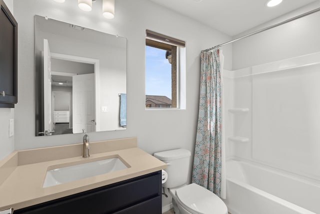 full bathroom featuring vanity, toilet, and shower / tub combo